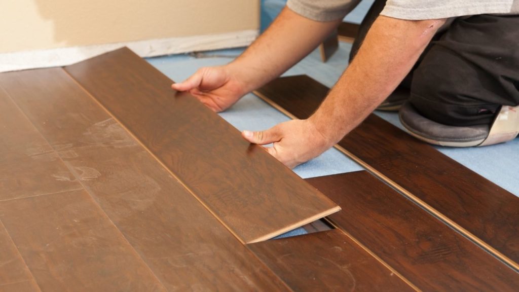 Worker Installing Engineered Wood Flooring